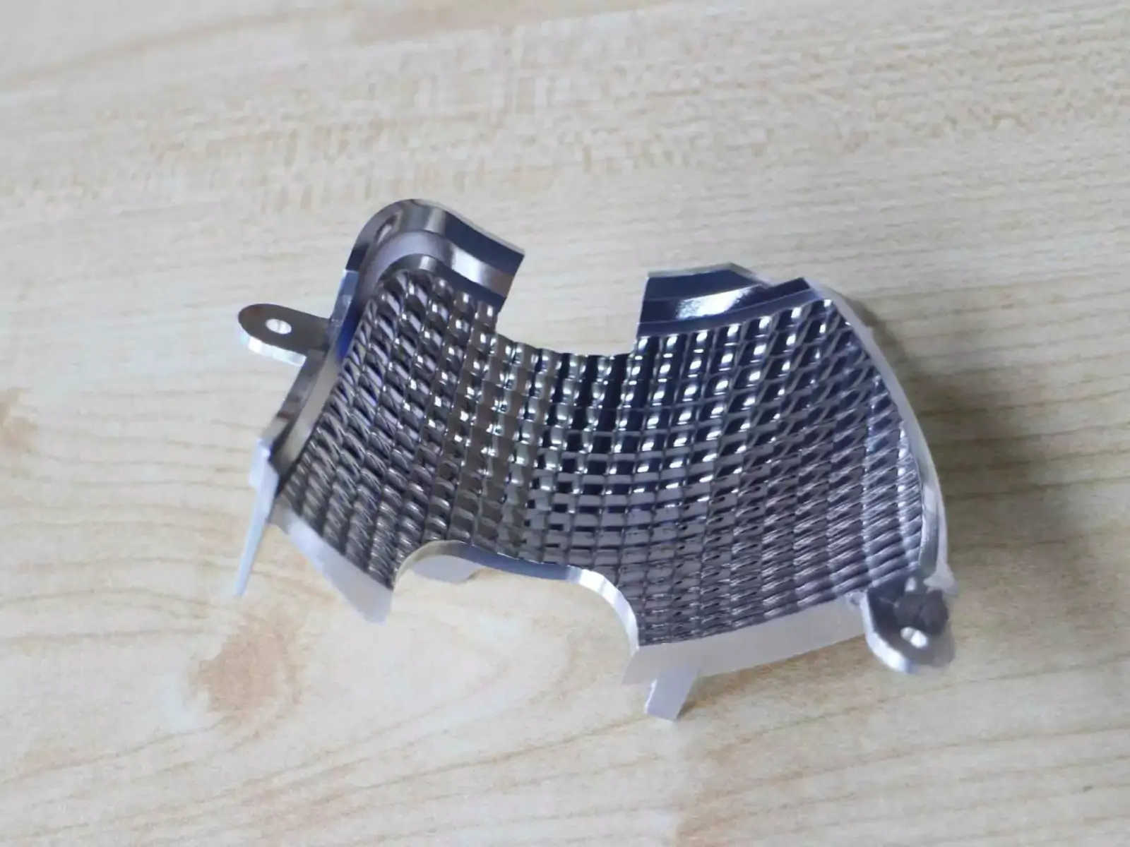 Sanding and polishing of CNC machined metal part achieving smooth reflective surface finish