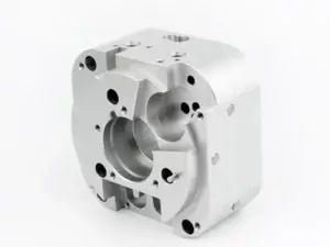 Sanding of CNC machined metal part achieving smooth reflective surface finish